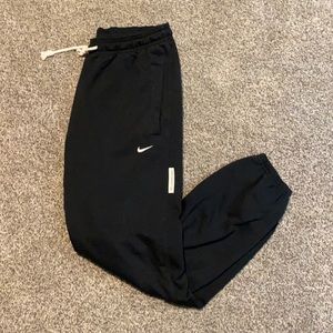 Black Nike Dri-Fit jogger sweatpants, size medium regular fit.